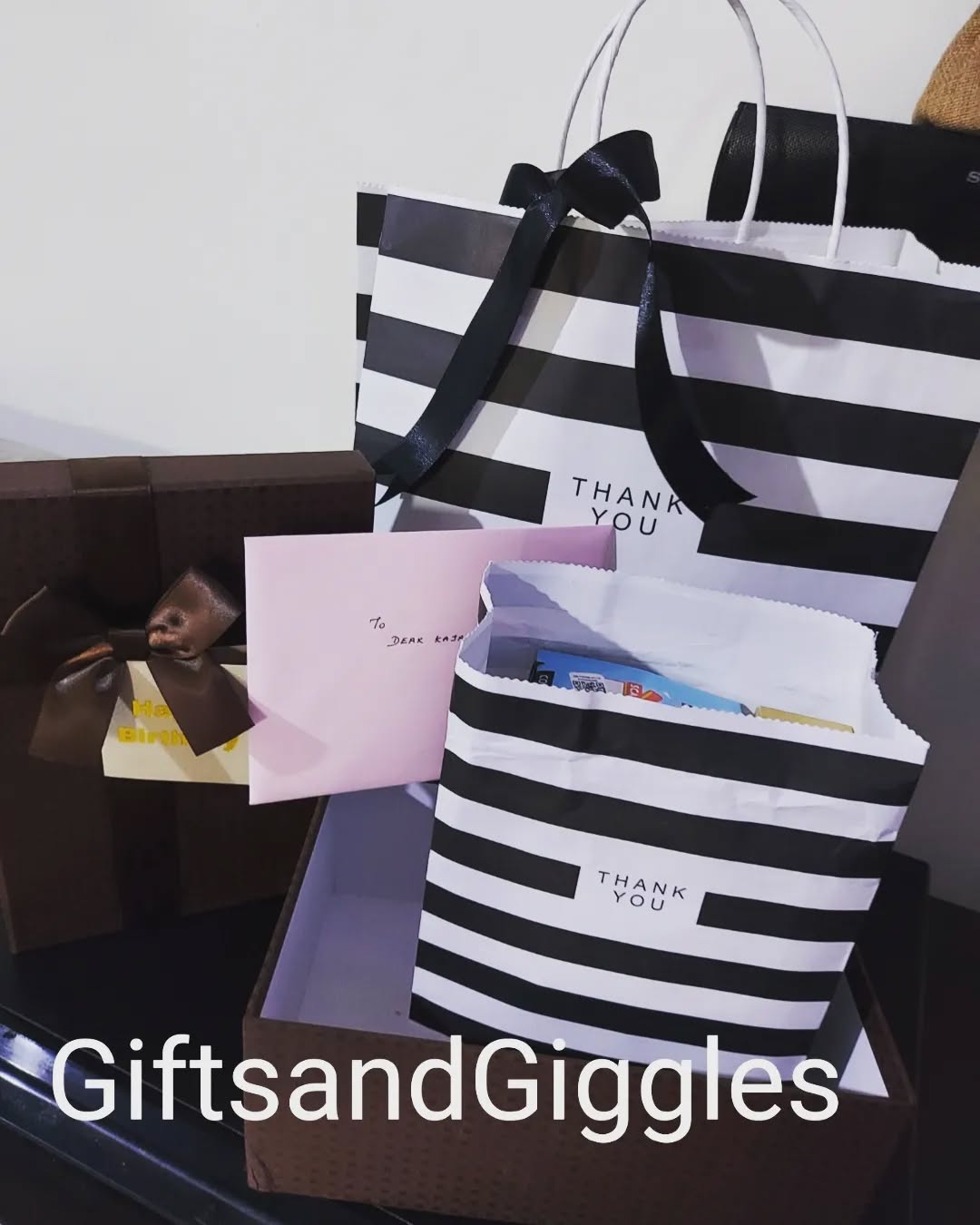 Elegant striped gift packaging with thank you notes
